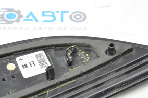 The right inner taillight of a Chevrolet Volt 11-15 has a broken mount and a chip.