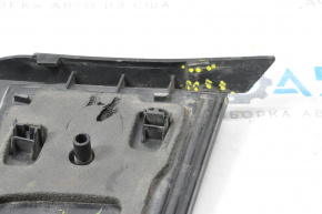 The right inner taillight of a Chevrolet Volt 11-15 has a broken mount and a chip.