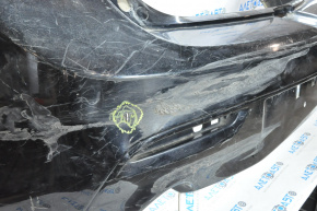 The rear bumper is bare and needs repair for a Mazda3 MPS 2009-2013. It's black and has a hole in it and a dent.