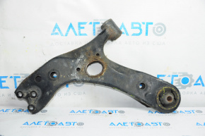 The lower front left control arm of a Lexus CT200h 11-17 is rusty and the silent block is torn.