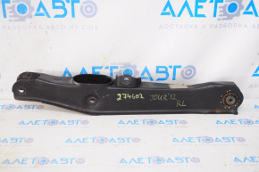 The lower rear left control arm of a Dodge Journey 11-20 has a torn silent block.