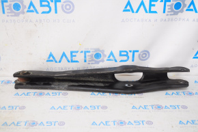 The lower rear left control arm of a Dodge Journey 11-20 has a torn silent block.