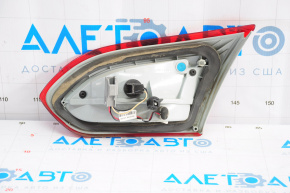 The left inner taillight on a Ford Focus mk3 15-18 restyling 4D has swollen paint.