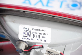 The left inner taillight on a Ford Focus mk3 15-18 restyling 4D has swollen paint.