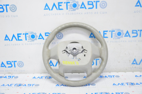 Naked steering wheel for a Toyota Sienna 11-15 with gray tires.
