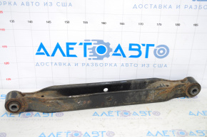 The lower rear left control arm of a 17-22 Nissan Rogue Sport is rusty.