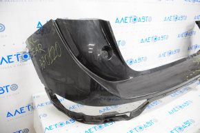 Rear bumper bare Lincoln MKC 15-19 black, missing right part, broken fasteners, dented, scratches
