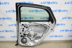 Door assembly rear right Ford Focus mk3 11-18 silver UX, dented
