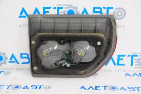 Light inside trunk lid left Dodge Durango 11-13 crack on glass