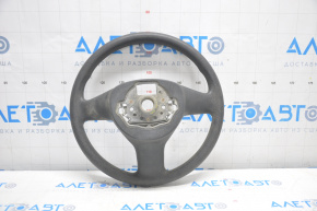 The steering wheel is bare, plastic, black, and a VW Tiguan 09-11 pre-restoration model.
