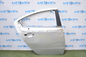 The bare rear right door of a Chevrolet Volt 11-15 silver is dented.