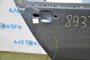 The door is bare rear right Chevrolet Volt 11-15 graphite dented along the sunset