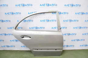 The door is bare, rear right Mercedes W211 silver, dent at the bottom, bumps