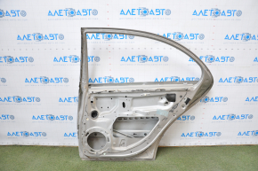 The door is bare, rear right Mercedes W211 silver, dent at the bottom, bumps