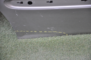 The door is bare, rear right Mercedes W211 silver, dent at the bottom, bumps