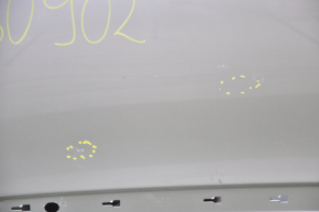 The door is bare, rear right Mercedes W211 silver, dent at the bottom, bumps