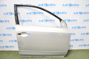 The front right door of a Nissan Murano z50 03-07 is bare and silver. It has a dent and bumps.
