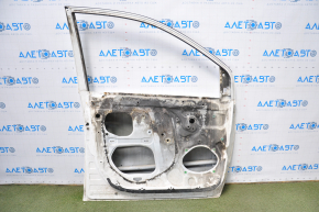 The door is bare, front left, Toyota Sienna 04-09, white, dented corner, bumps, burnt