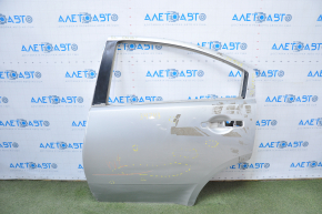 The door is bare, rear left, Mitsubishi Galant 04-06 pre-rest silver, dented, bumps