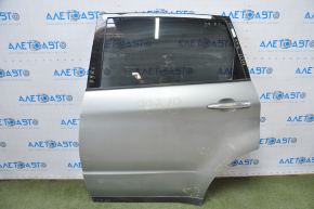 Subaru b9 Tribeca rear left door assembly, silver, dent in the lower corner, bumps, painted