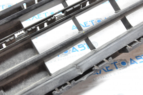 Lower grille of the front bumper of a VW Jetta 15-18 USA without parking sensors, pressed from below, tears