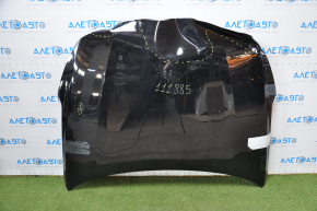 The hood of a Kia Optima 16-20 black is dented in the front, bumps