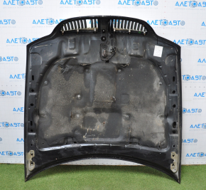 The hood assembly of a 98-11 Lincoln Town Car has black bumps, bulging chrome, and a broken grille.
