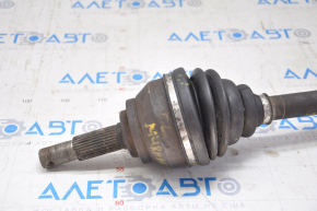 The front left drive axle shaft of a Nissan Murano z50 03-07 has a torn outer boot.