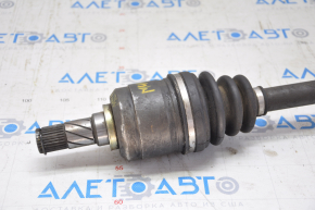 The front left drive axle shaft of a Nissan Murano z50 03-07 has a torn outer boot.