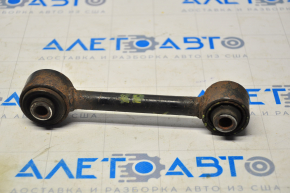 The rear right control arm of a Jeep Compass 11-16 has a torn silent block.