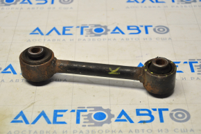 The rear right control arm of a Jeep Compass 11-16 has a torn silent block.