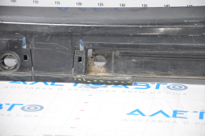 The left threshold of a Toyota Prius V 12-17 has a broken mount.