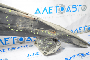 The front bumper reinforcement of the Tesla Model S 12-15 pre-restoration is dented on the right side, the fangs are cracked