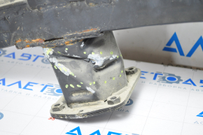 The front bumper reinforcement of the Tesla Model S 12-15 pre-restoration is dented on the right side, the fangs are cracked