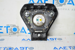 The steering wheel airbag on the driver's side of the Hyundai Sonata 11-15 has a dent on the badge.