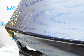The trunk lid of Chevrolet Malibu 16-23 is dented at the bottom edge, pokes