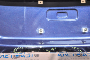 The trunk lid of Chevrolet Malibu 16-23 is dented at the bottom edge, pokes