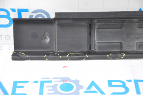 The left door sill trim of a Mercedes X164 GL is dented under the sill.