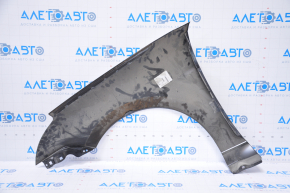 The front right fender of a Ford Focus 2008-2010 is dented, the mount is damaged, the bump is broken