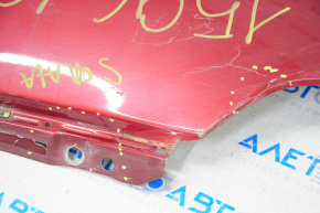 Front left wing Hyundai Sonata 15-17, red, dented near the door, material tear