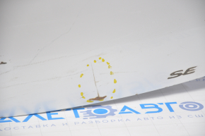 The trunk lid of a Toyota Solara 2.4 04-08 dent