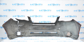 The front bumper of a Subaru Forester 14-16 SJ pre-rest red is dented, has tears, broken fasteners, and scratches.