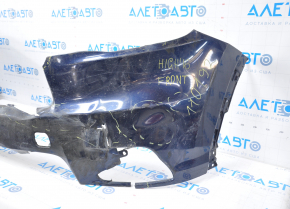 The front bumper of a Toyota Highlander 14-16 is bare and blue, dented, has tears, and is missing fragments.