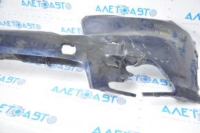 The front bumper of a Toyota Highlander 14-16 is bare and blue, dented, has tears, and is missing fragments.