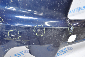 The front bumper of a Toyota Highlander 14-16 is bare and blue, dented, has tears, and is missing fragments.