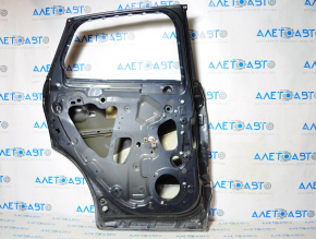 The door is bare rear left Lincoln MKC 15-19 blue dented along the pillar