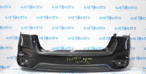 Bare rear bumper Nissan Sentra 16-19 rest black tear at the bottom, torn fasteners, sawed corner, dented