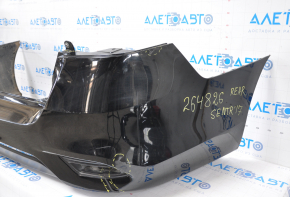 Bare rear bumper Nissan Sentra 16-19 rest black tear at the bottom, torn fasteners, sawed corner, dented