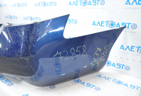 The rear bumper is bare, Toyota Camry v40 07-11 3.5 SE blue, dented, torn, with broken fasteners.