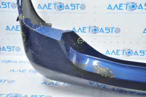 The rear bumper is bare, Toyota Camry v40 07-11 3.5 SE blue, dented, torn, with broken fasteners.
